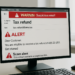 suspicious email regarding tax refund with alerts in modern office